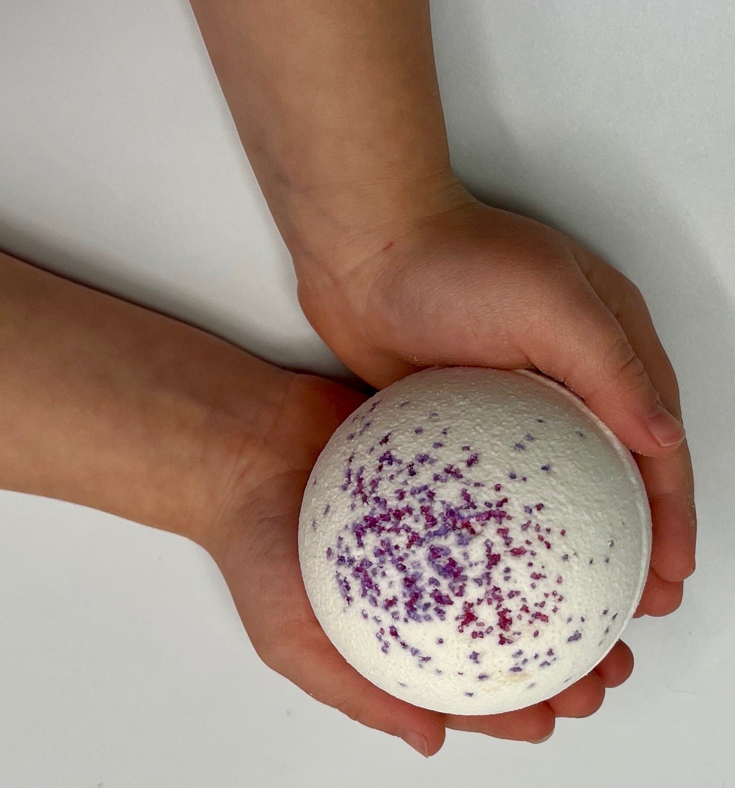 large, all-natural bath bombs with animal toy hidden inside