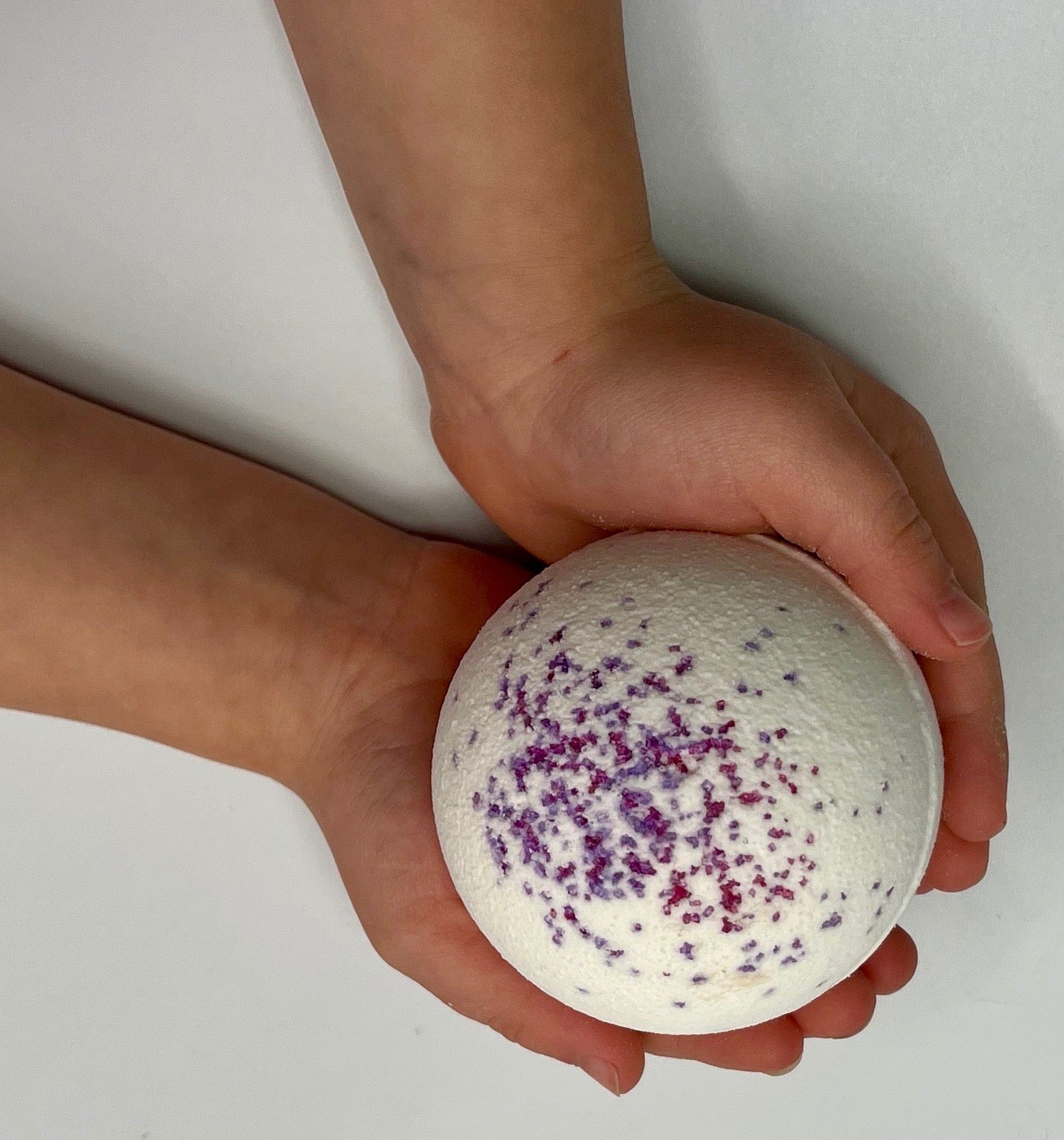 large, all-natural bath bombs with animal toy hidden inside